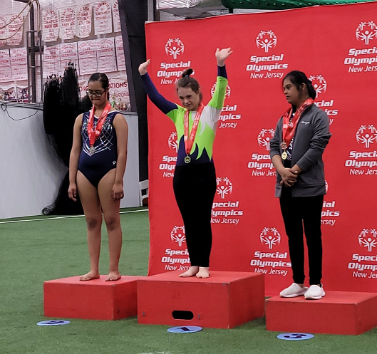 Ally Kistler winning an award at the Special Olympics