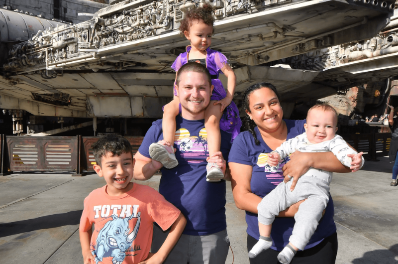 Imani Waldman holds her infant son next to her husband, daughter and older son.