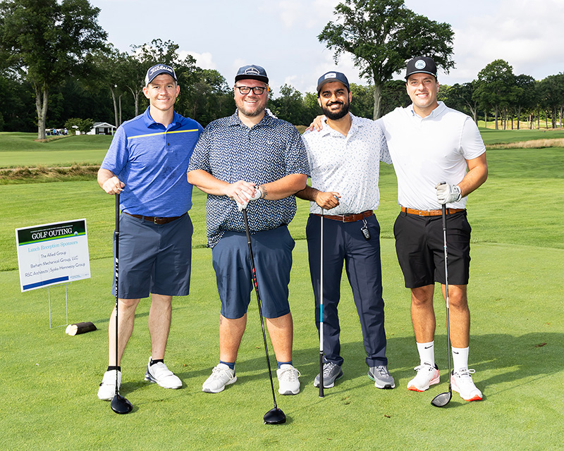 team members posing during HMH annual golf outing