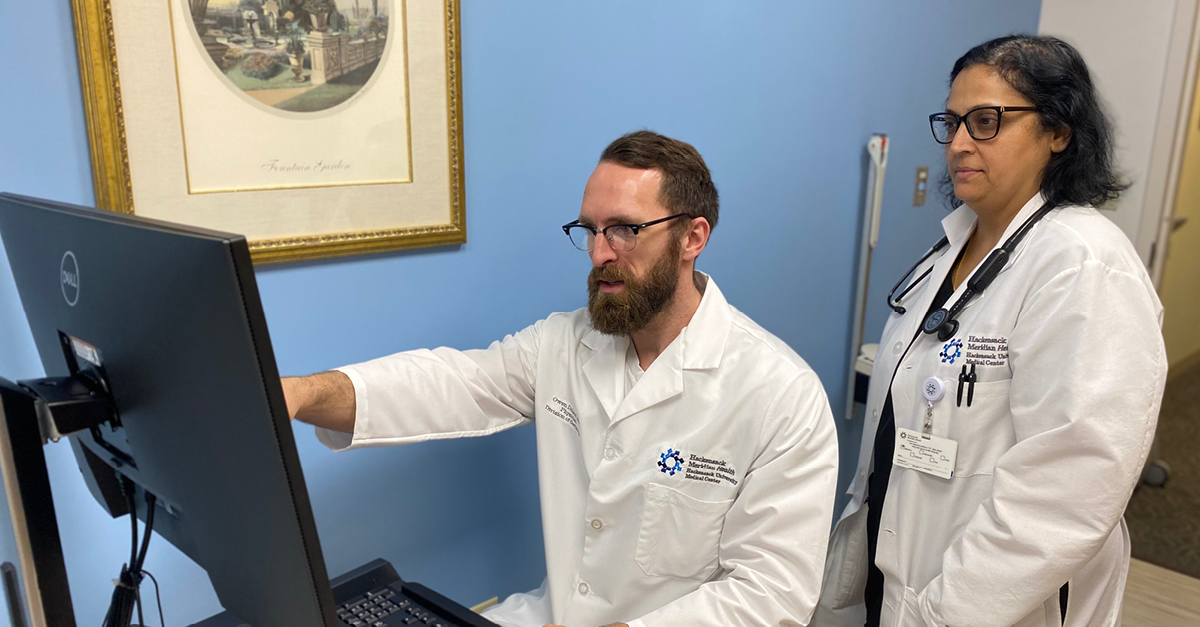 two doctors in front of computer